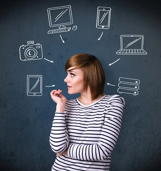 Young woman thinking with drawn gadgets around her head — Stock Photo, Image