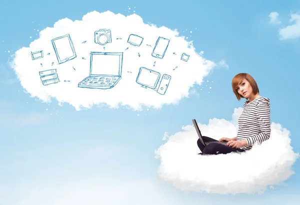 Young woman sitting in cloud with laptop — Stock Photo, Image