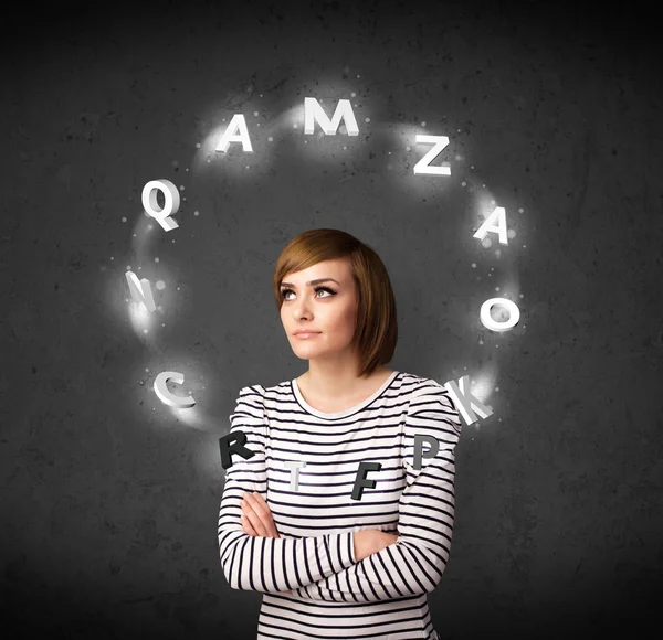 Young woman thinking with letter circulation around her head — Stock Photo, Image