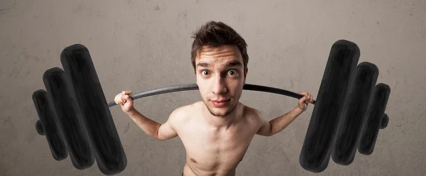 Funny skinny guy lifting weights — Stock Photo, Image