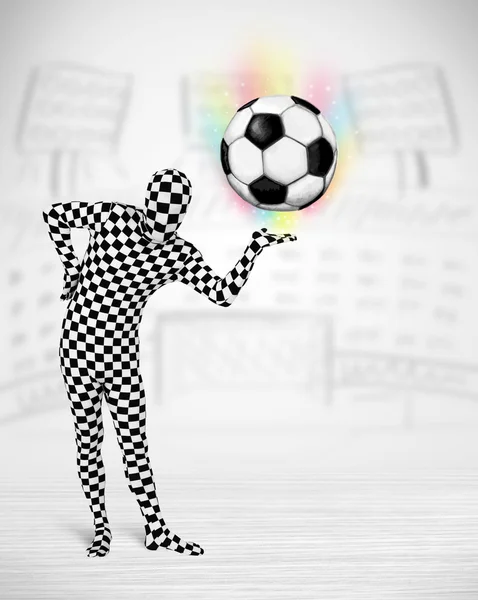 Man in full body suit holdig soccer ball — Stock Photo, Image