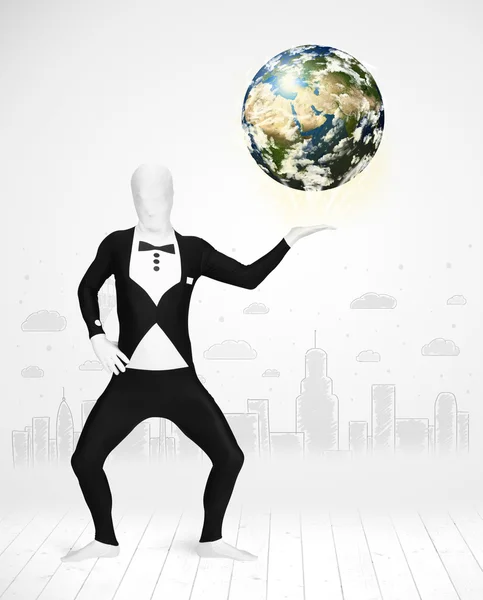 Man in full body suit holding planet earth — Stock Photo, Image