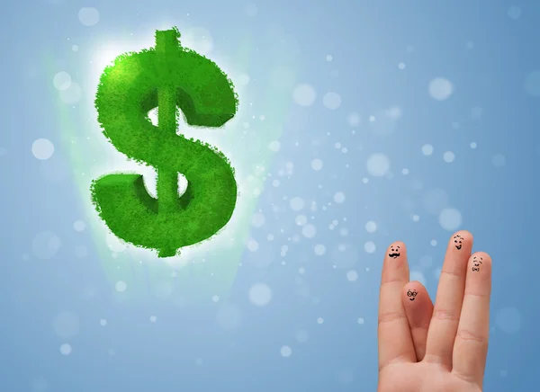 Happy smiley fingers looking at green leaf dollar sign — Stock Photo, Image