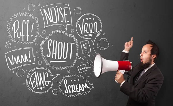 Guy in suit yelling into megaphone and hand drawn speech bubbles — Stock Photo, Image