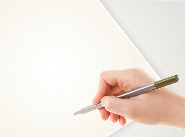 Hand writing on plain empty white paper copy space — Stock Photo, Image