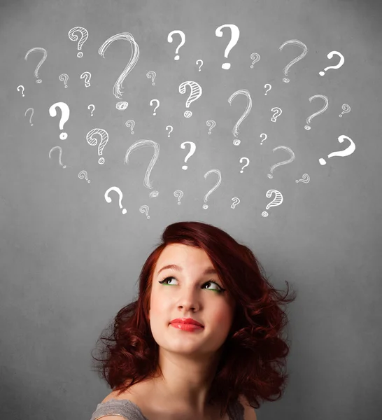 Young woman with question marks above her head — Stock Photo, Image