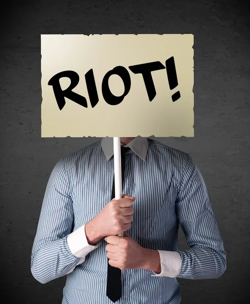 Businessman holding a protest sign — Stock Photo, Image