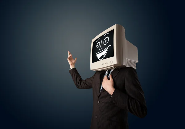 Hombre de negocios feliz con una cabeza de monitor de PC y una cara sonriente — Foto de Stock