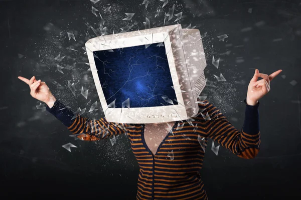 Computer monitor screen exploding on a young persons head — Stock Photo, Image