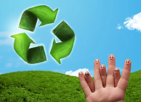 Happy smiley fingers looking at green leaf recycle sign — Stock Photo, Image
