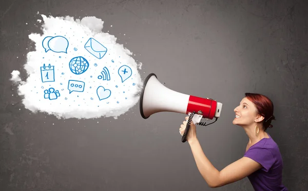 Woman shouting into loudspeaker and modern blue icons and symbol — Stock Photo, Image