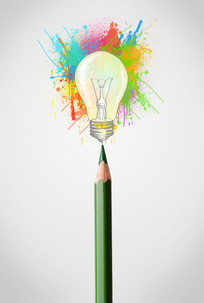 Pencil close-up with colored paint splashes and lightbulb