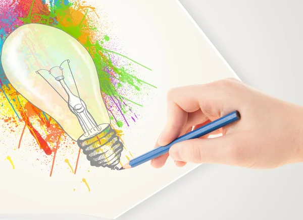 Hand drawing on paper a colorful splatter lightbulb — Stock Photo, Image