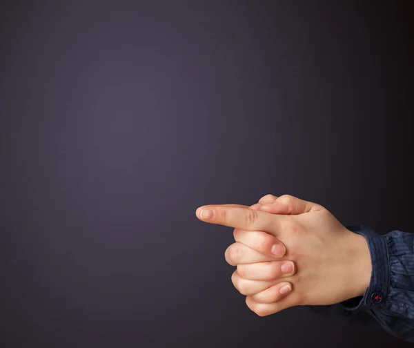 Gun shaped woman hand — Stock Photo, Image