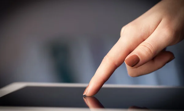 Finger pointing on tablet pc with empty space — Stock Photo, Image