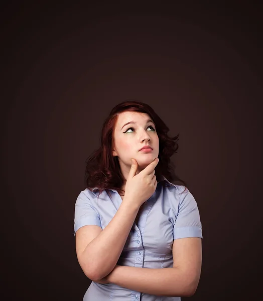 Young woman thinking with copy space — Stock Photo, Image