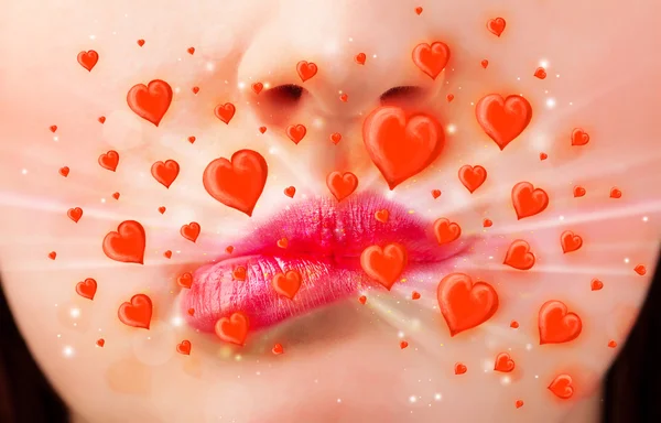 Pretty lady lips with lovely red hearts — Stock Photo, Image