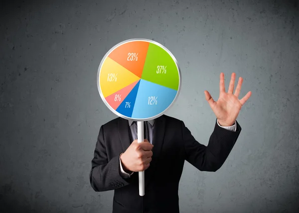 Businessman holding a pie chart — Stock Photo, Image