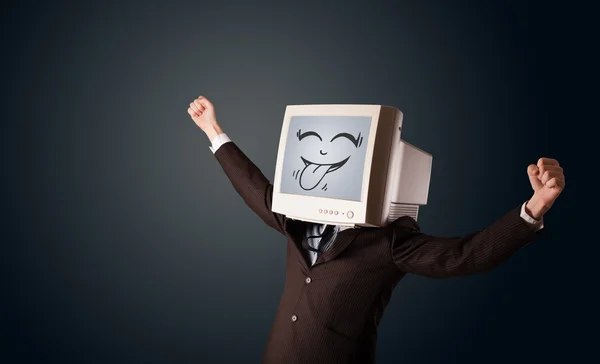 Hombre de negocios feliz con un monitor de computadora y una cara sonriente — Foto de Stock