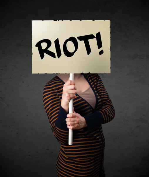 Young woman holding a protest sign — Stock Photo, Image