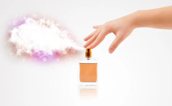 Woman hands spraying colorful cloud — Stock Photo, Image