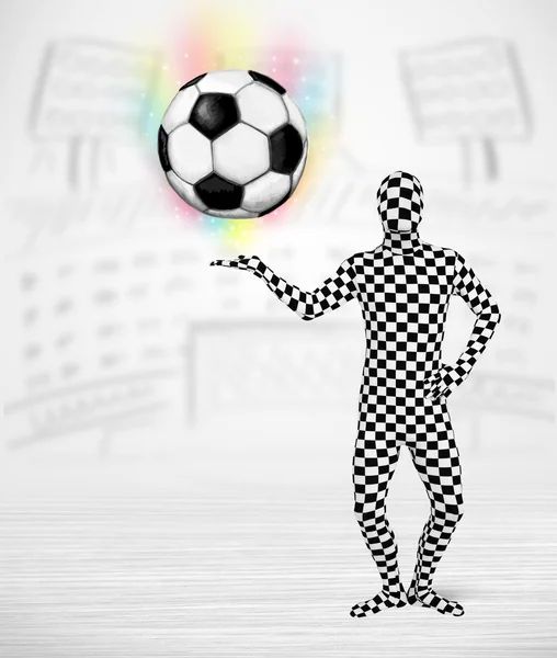 Man in full body suit holdig soccer ball — Stock Photo, Image