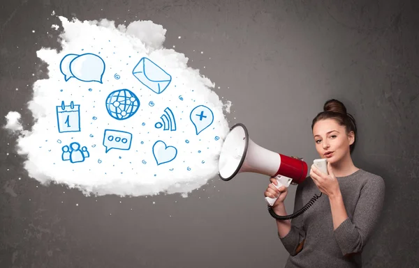 Woman shouting into loudspeaker and modern blue icons and symbol — Stock Photo, Image