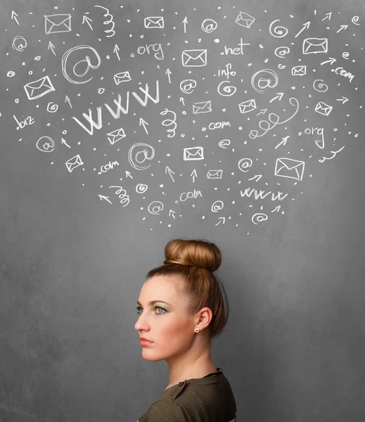 Young woman thinking with social network icons above her head — Stock Photo, Image