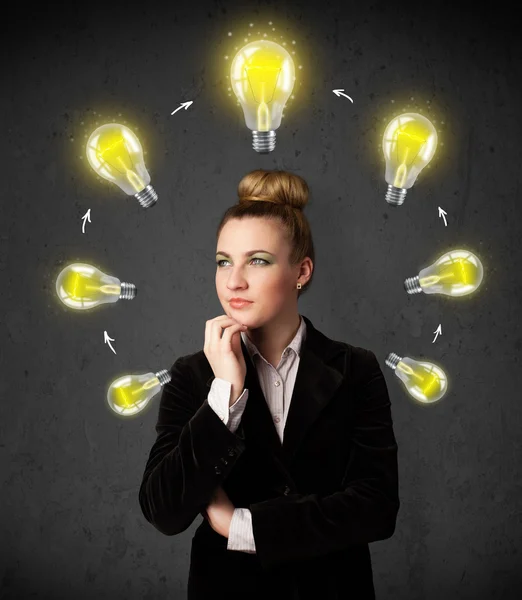 Young woman thinking with lightbulb circulation around her head — Stock Photo, Image