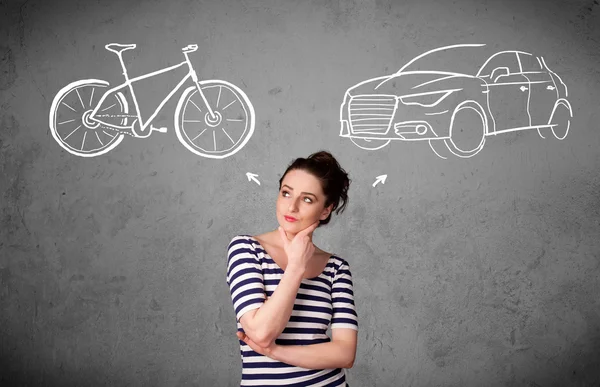 Woman making a choice between bicycle and car — Stock Photo, Image