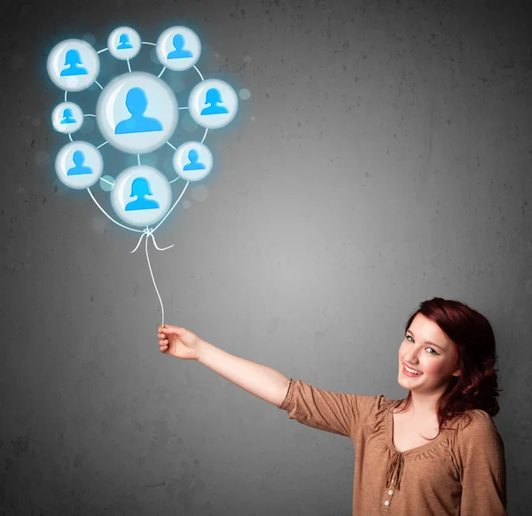 Woman holding social network balloon — Stock Photo, Image