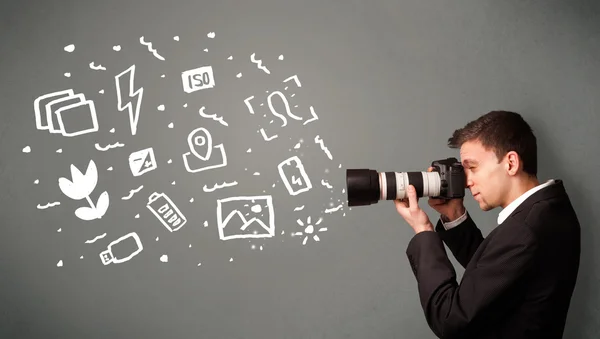 Photographer boy capturing white photography icons and symbols — Stock Photo, Image