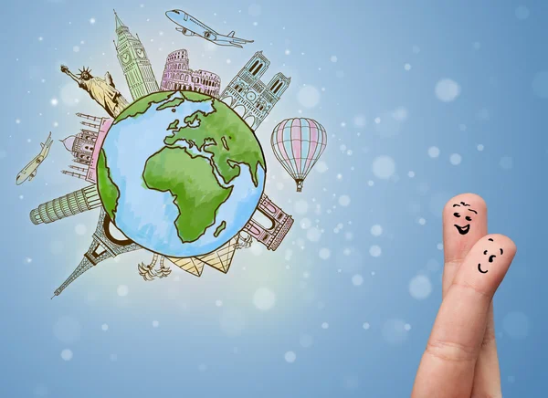 Cheerful finger smileys with famous landmarks of the globe — Stock Photo, Image