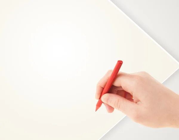 Child drawing with colorful crayon on empty blank paper — Stock Photo, Image