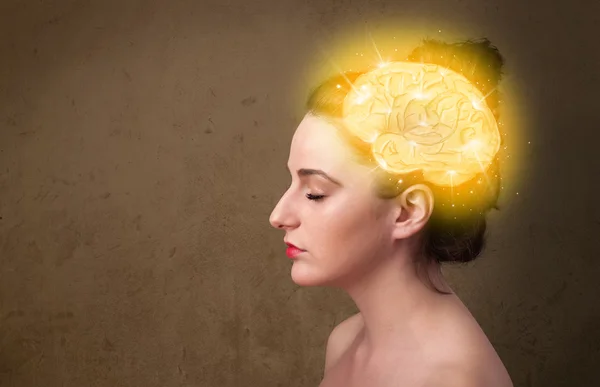 Young girl thinking with glowing brain illustration — Stock Photo, Image