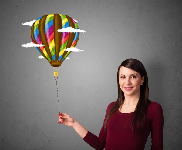 Žena drží balon výkresu — Stock fotografie