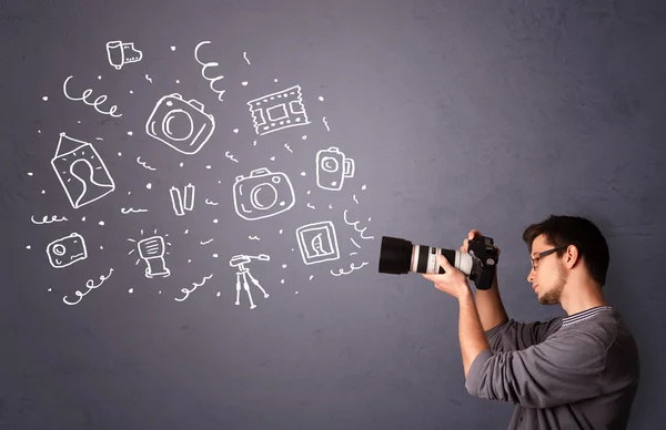 Young photographer shooting photography icons — Stock Photo, Image