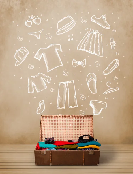 Traveler luggage with hand drawn clothes and icons — Stock Photo, Image