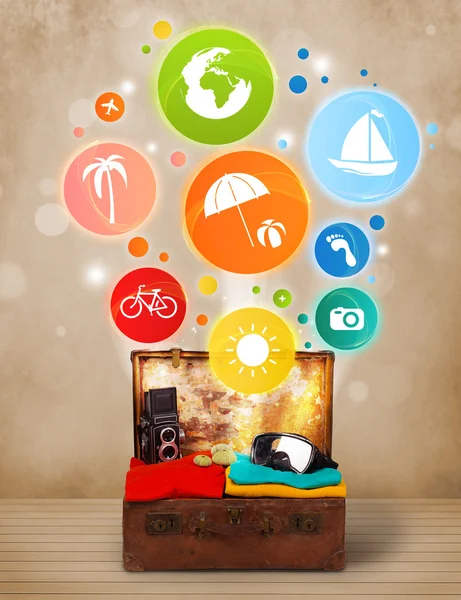 Suitcase with colorful summer icons and symbols — Stock Photo, Image