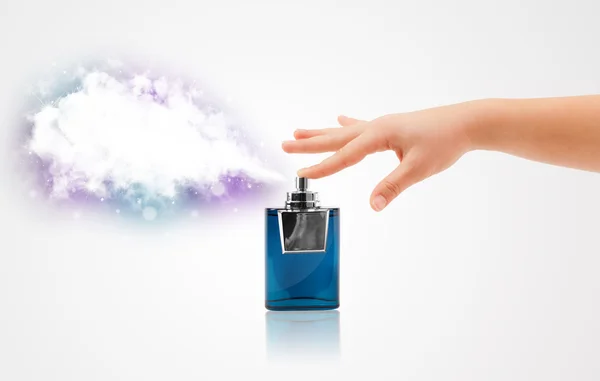 Woman hands spraying colorful cloud — Stock Photo, Image