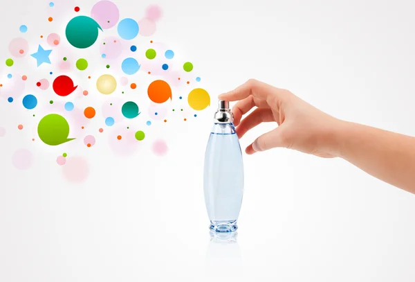 Woman hands spraying colorful bubbles — Stock Photo, Image