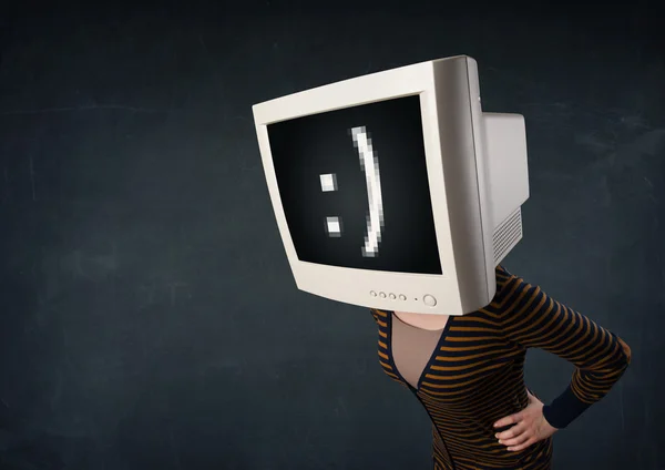 Funny girl with a monitor box on her head and a smiley face — Stock Photo, Image