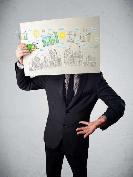 Businessman holding a paper with charts and cityscape in front o — Stock Photo, Image