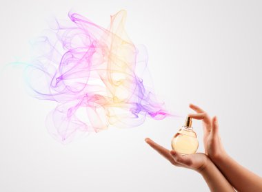 Woman hands spraying perfume clipart