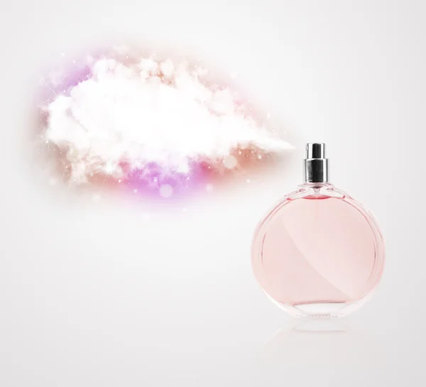 Beautiful bottle spraying colorful cloud — Stock Photo, Image