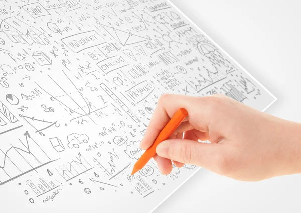 Human hand sketching ideas on a white paper — Stock Photo, Image