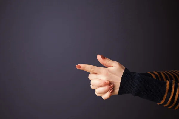 Gun shaped woman hand — Stock Photo, Image