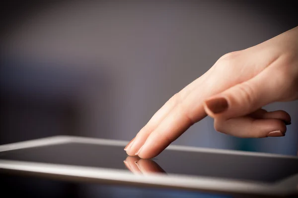 Finger pointing on tablet pc with empty space — Stock Photo, Image