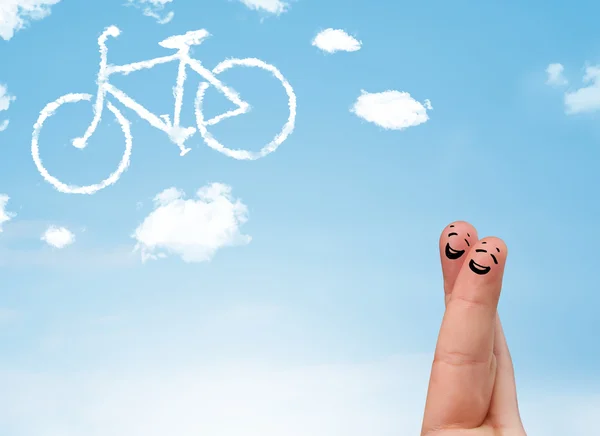 Happy smiley fingers looking at a bicycle shapeed cloud — Stock Photo, Image