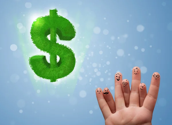 Happy smiley fingers looking at green leaf dollar sign — Stock Photo, Image